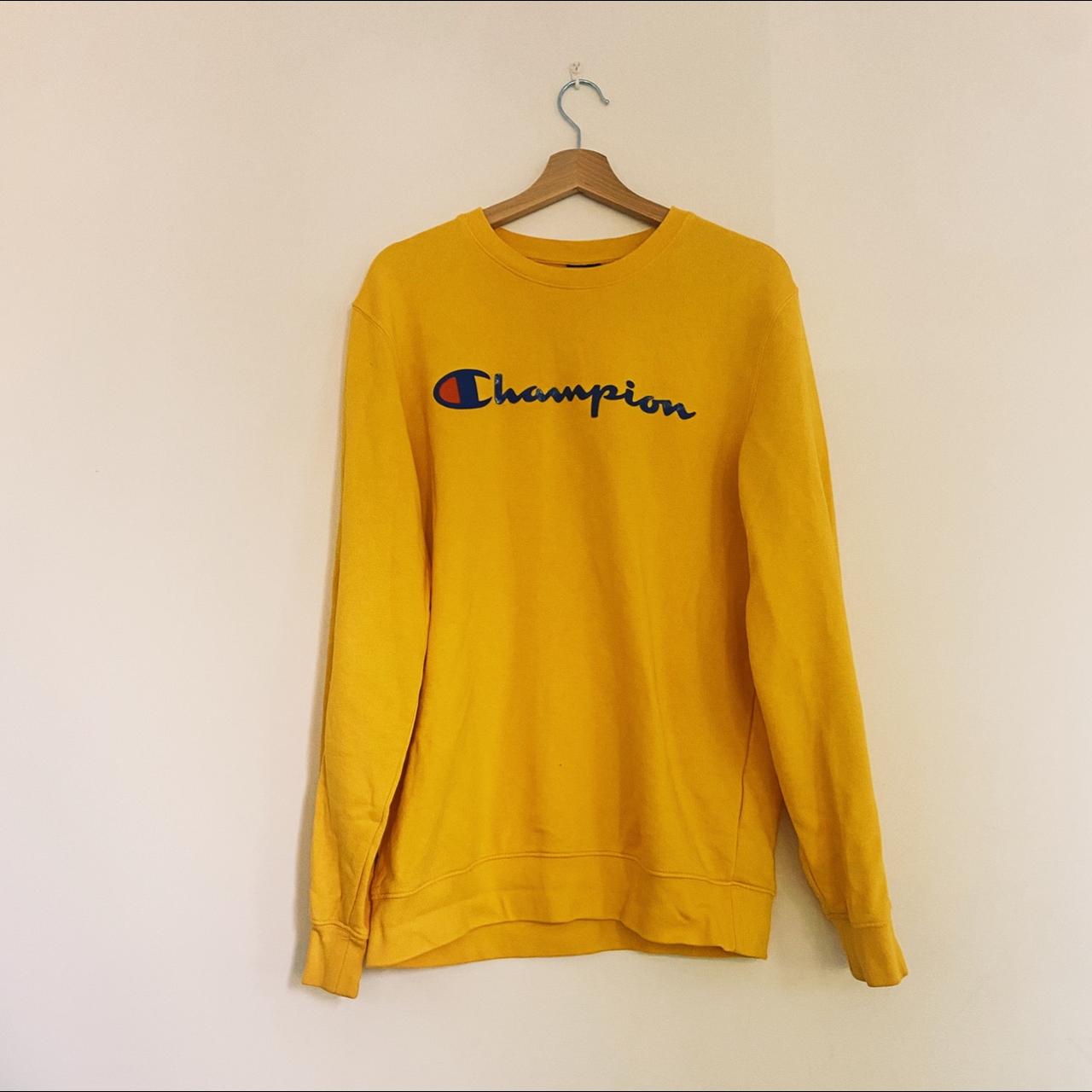 Yellow Champion jumper with blue logo Label says