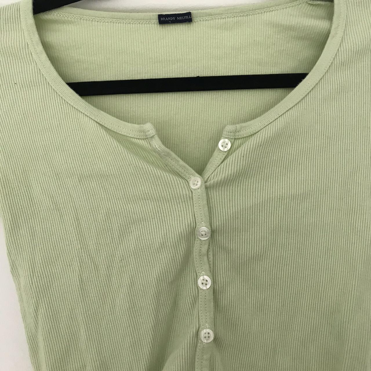 Brandy Melville lime green zelly button up top, so... Depop