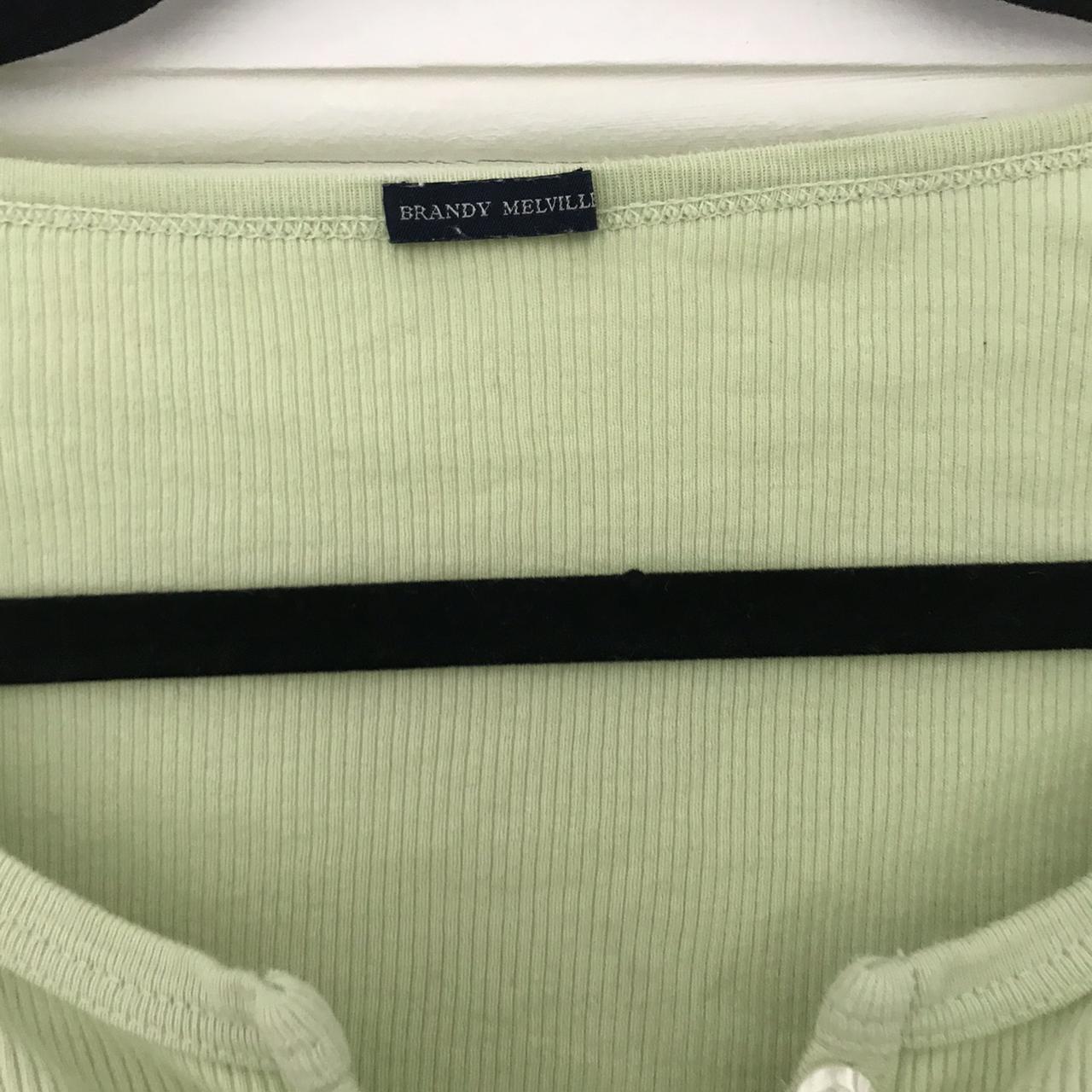 Brandy Melville lime green zelly button up top, so... Depop