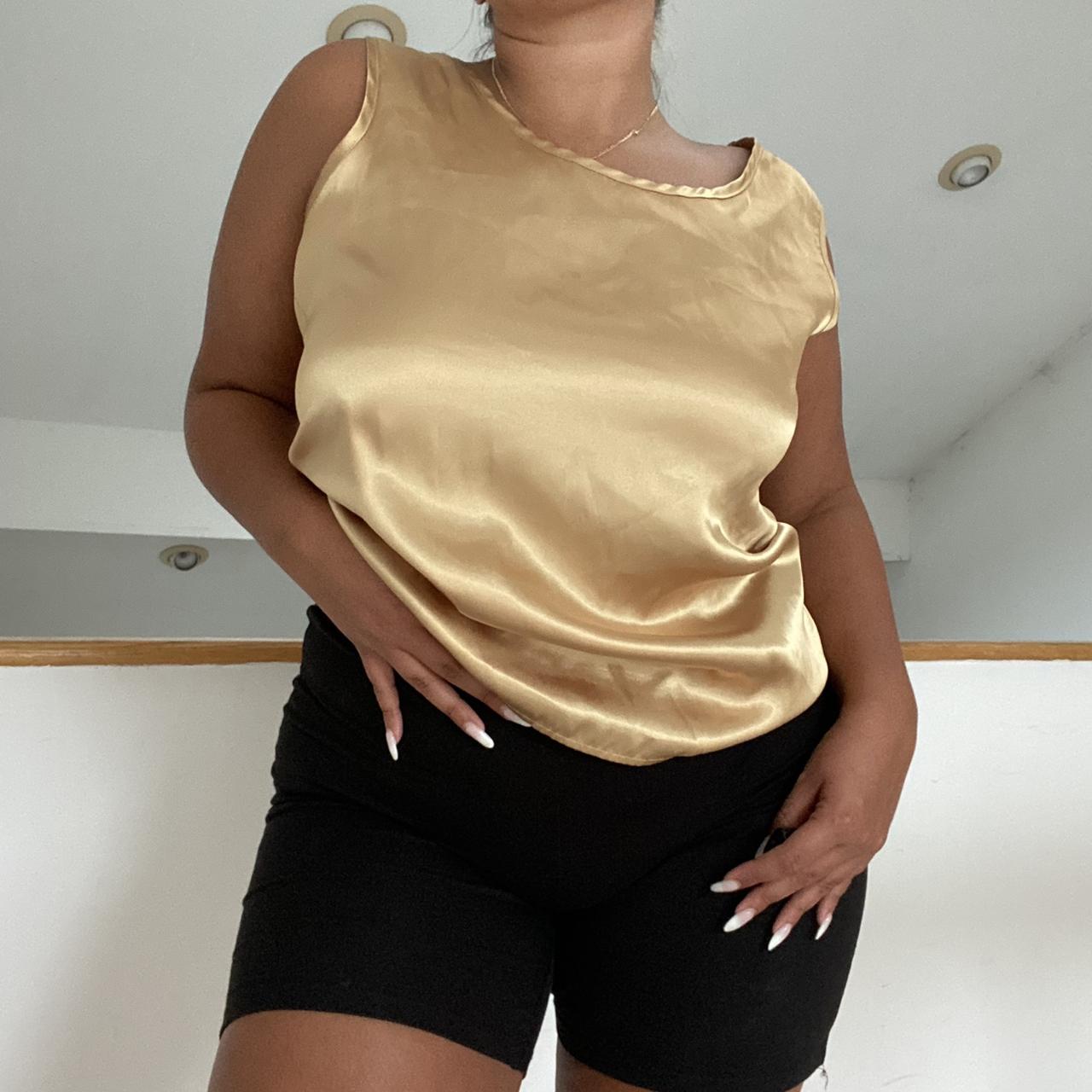 gold tank top📀 has a smooth, satiny feel. a fun,... Depop