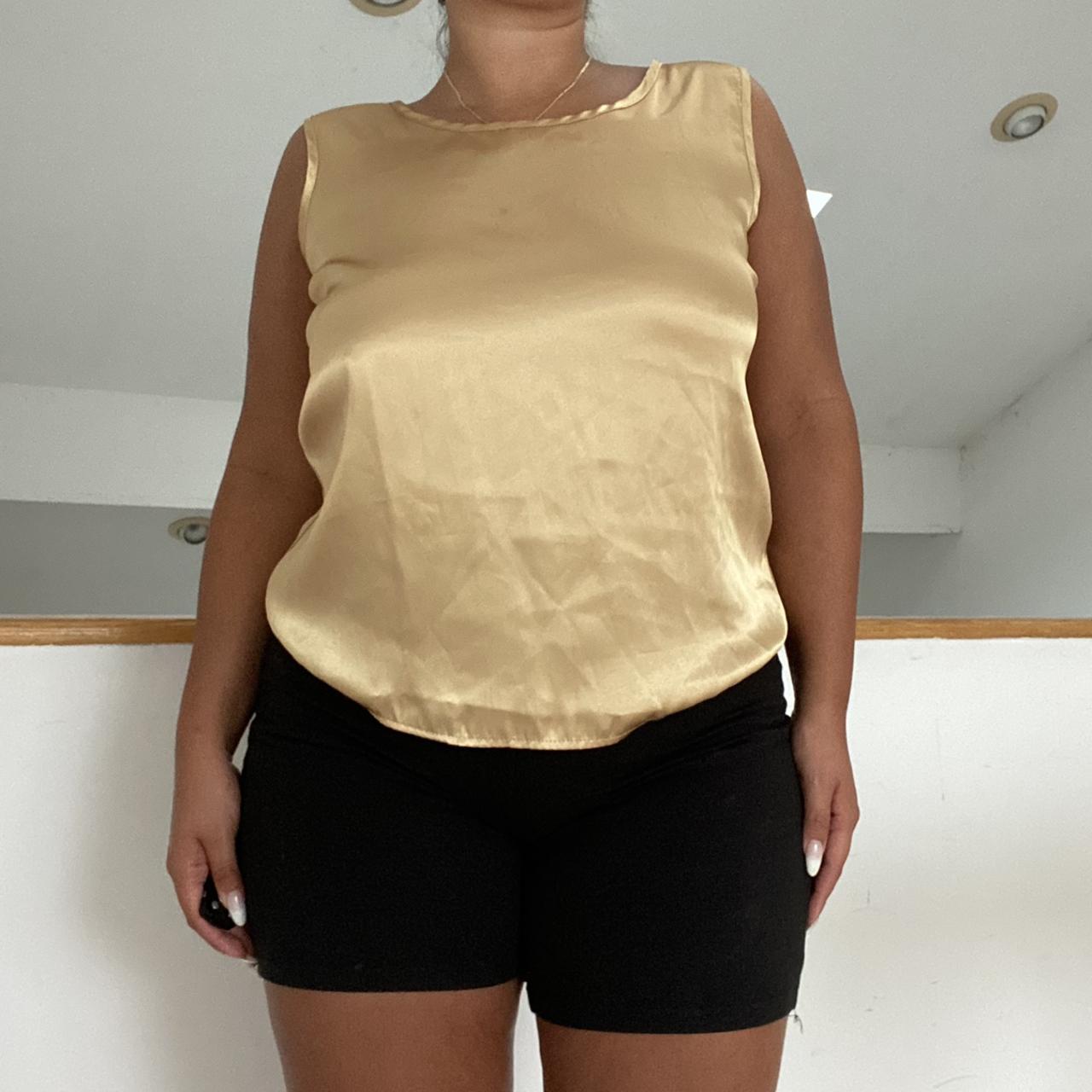 gold tank top📀 has a smooth, satiny feel. a fun,... Depop
