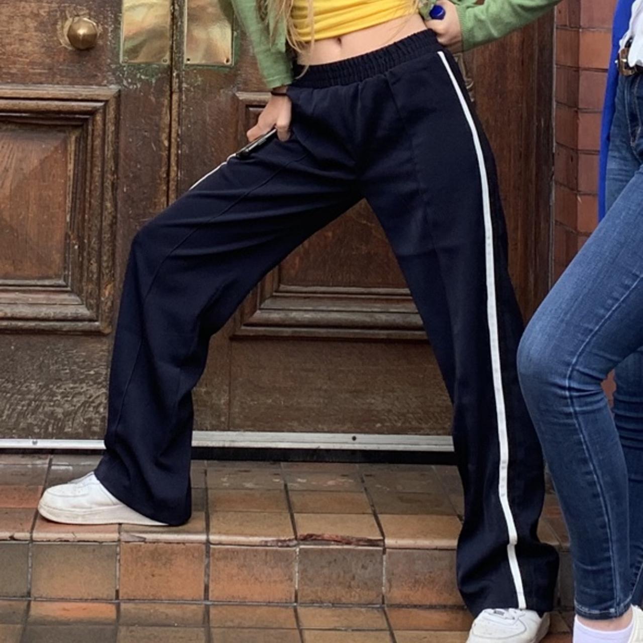 Baggy, navy blue tracksuit pants with white stripes... Depop