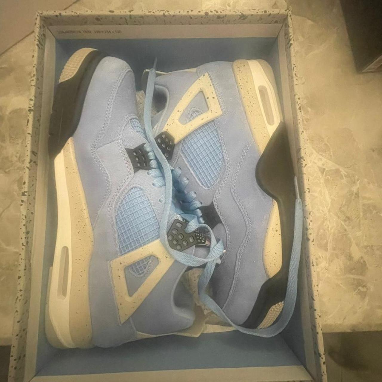 university blue jordan 4 retail