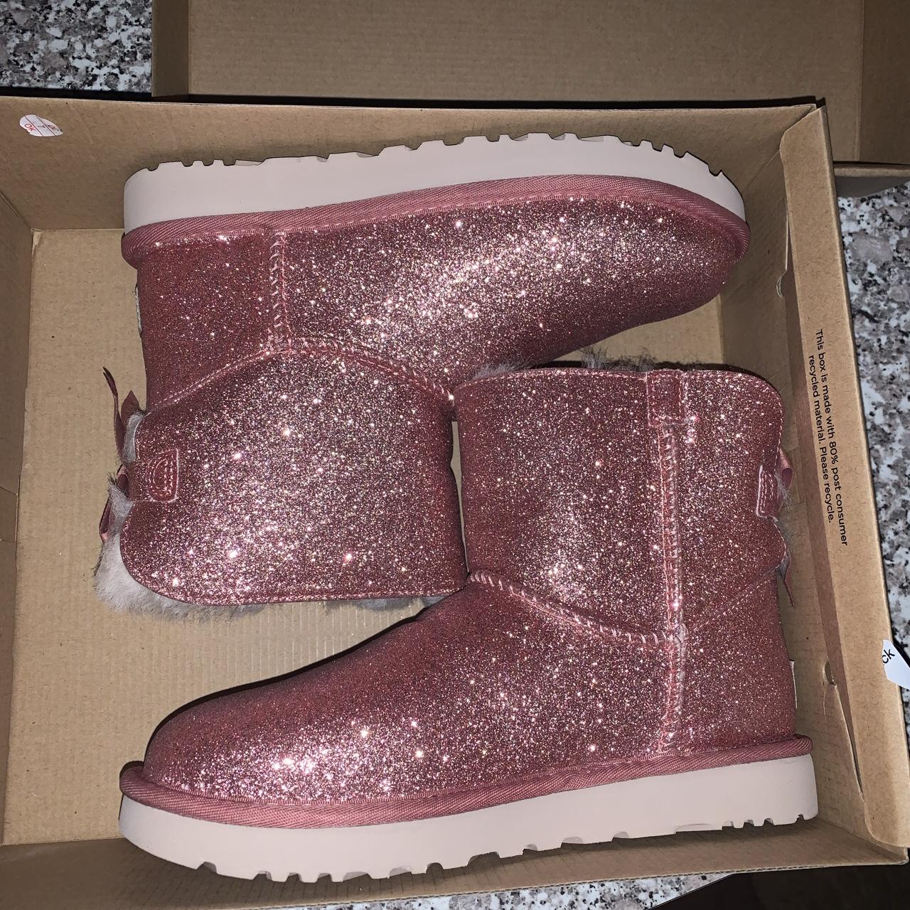 Size 7 mini bailey bow pink sparkle uggs. Never worn