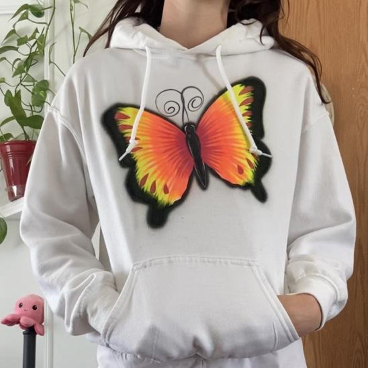 Black hoodie shop with orange butterfly