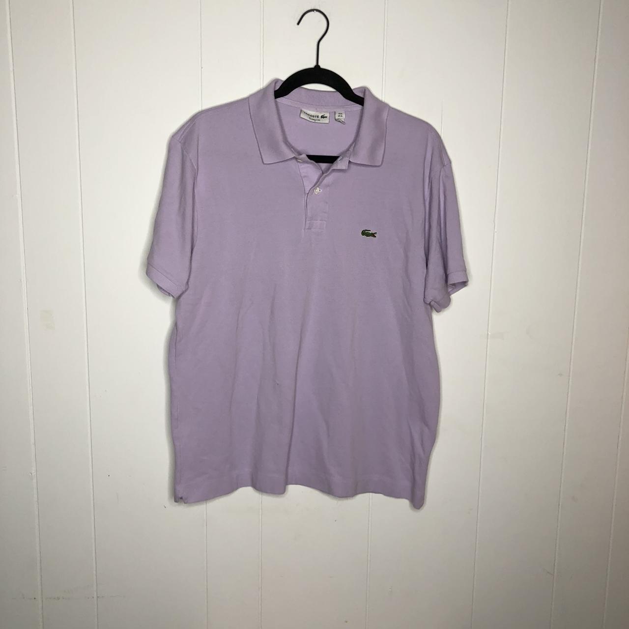 Stylish lavender polo by Lacoste. Fabric is clean Depop