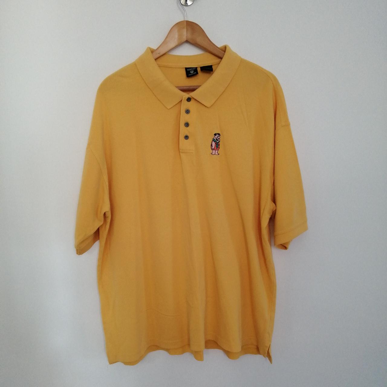 Bright yellow Fred Flintstone polo shirt by Warner... - Depop