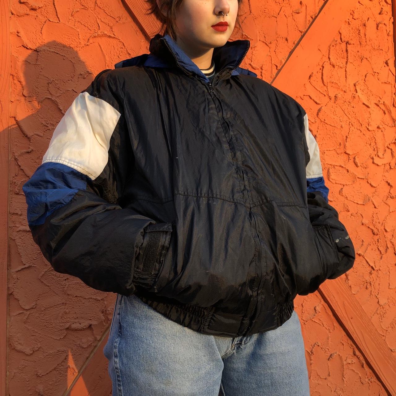 Black color block blue and white coat. 100 nylon... Depop