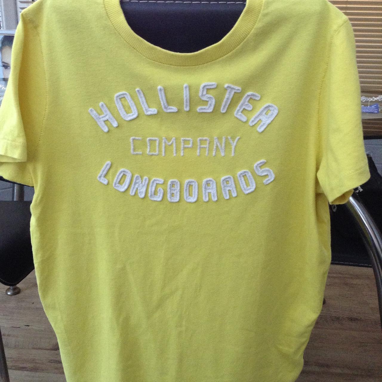 white shirt with yellow writing