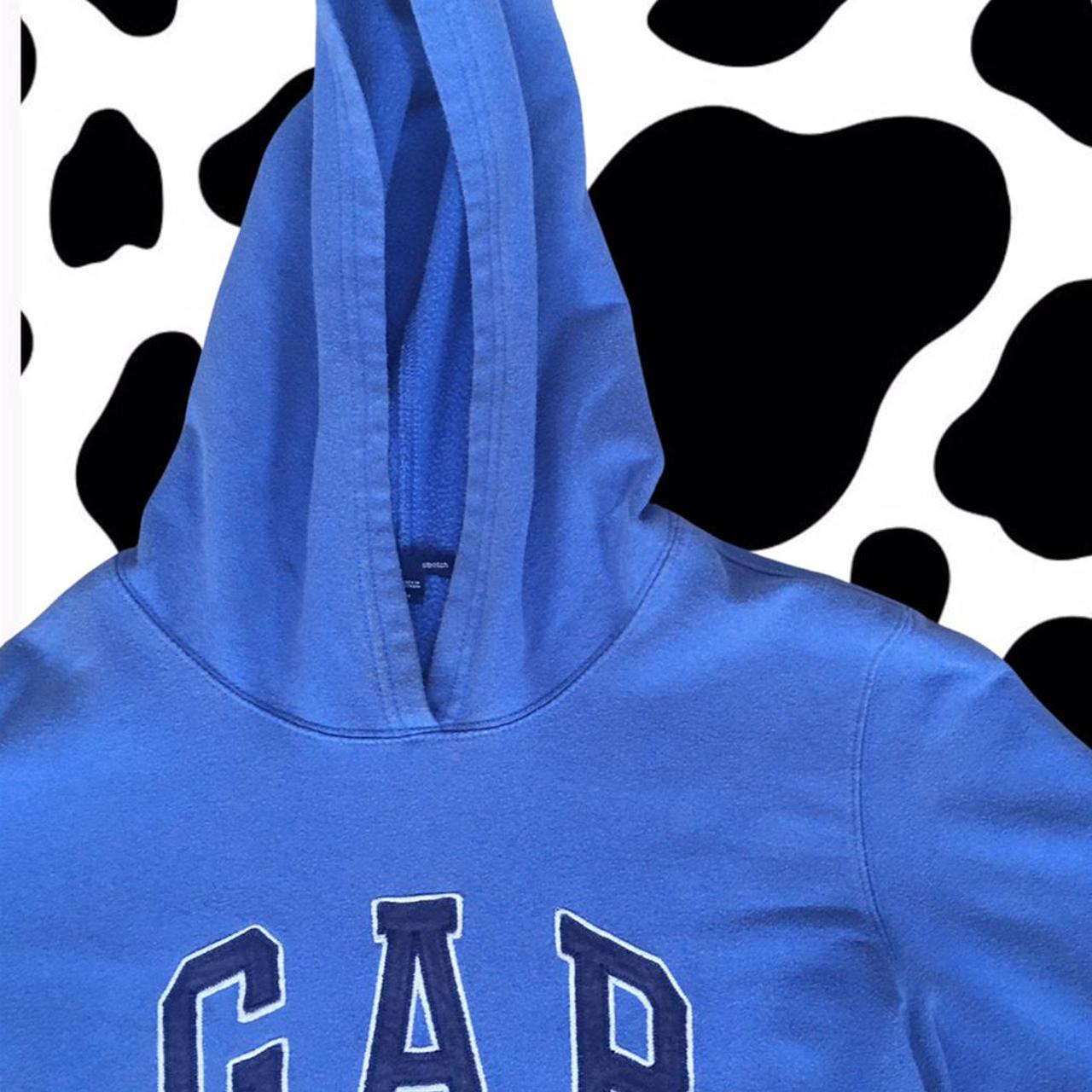 Baby blue GAP hoodie with an embroidered navy blue... Depop