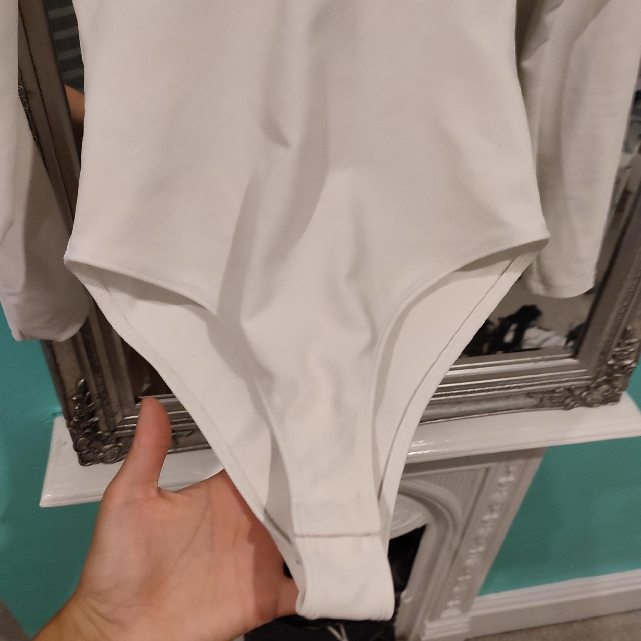 white bodysuit, long sleeved, size XS would fit... Depop