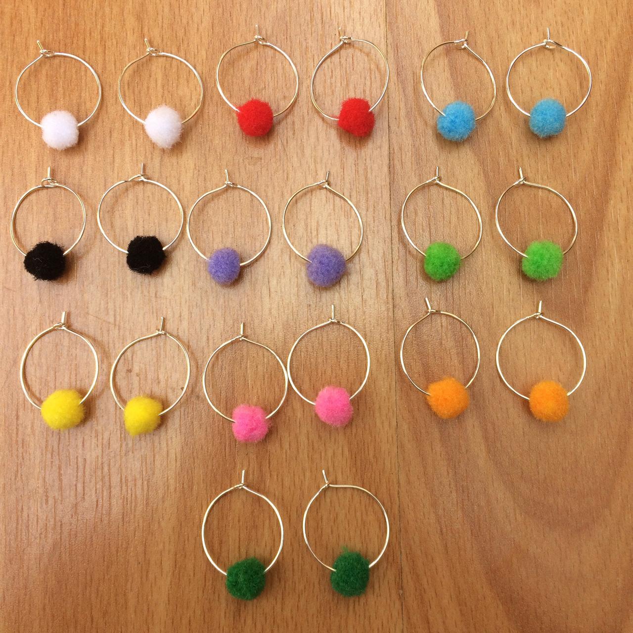 Hoop earrings with pom on sale poms