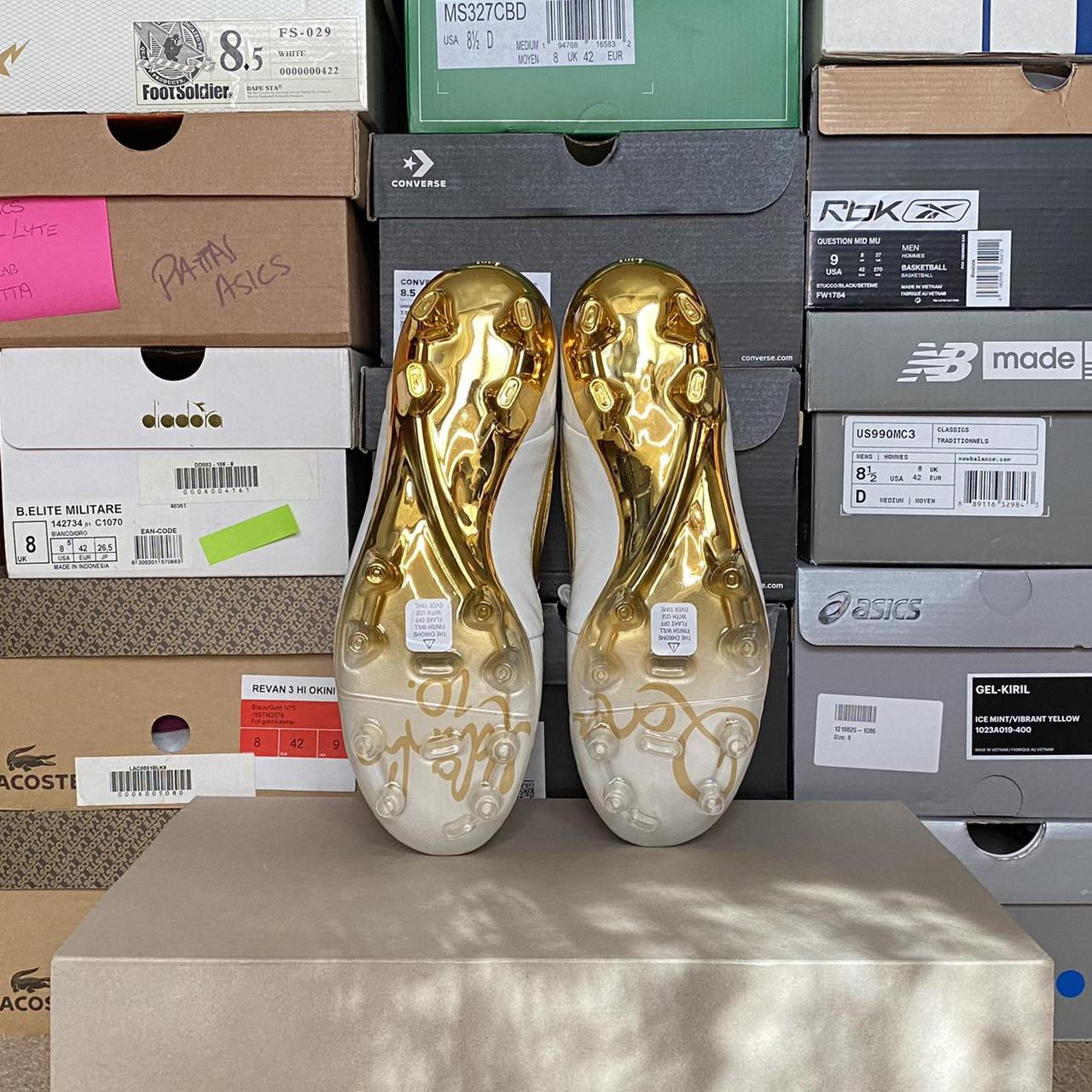 nike gold and black boots