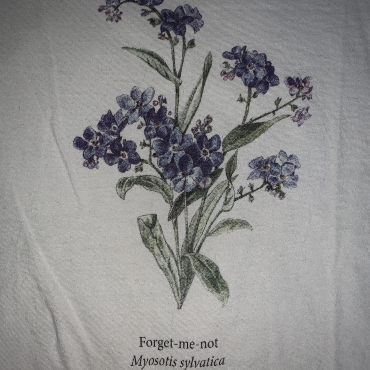 Brandy Melville “forget me not” t-shirt with floral - Depop