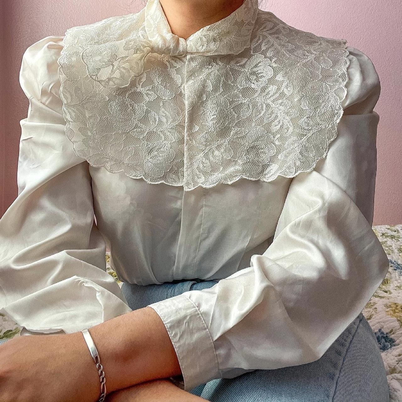 Vintage 80s ivory blouse featuring a large lace bib...