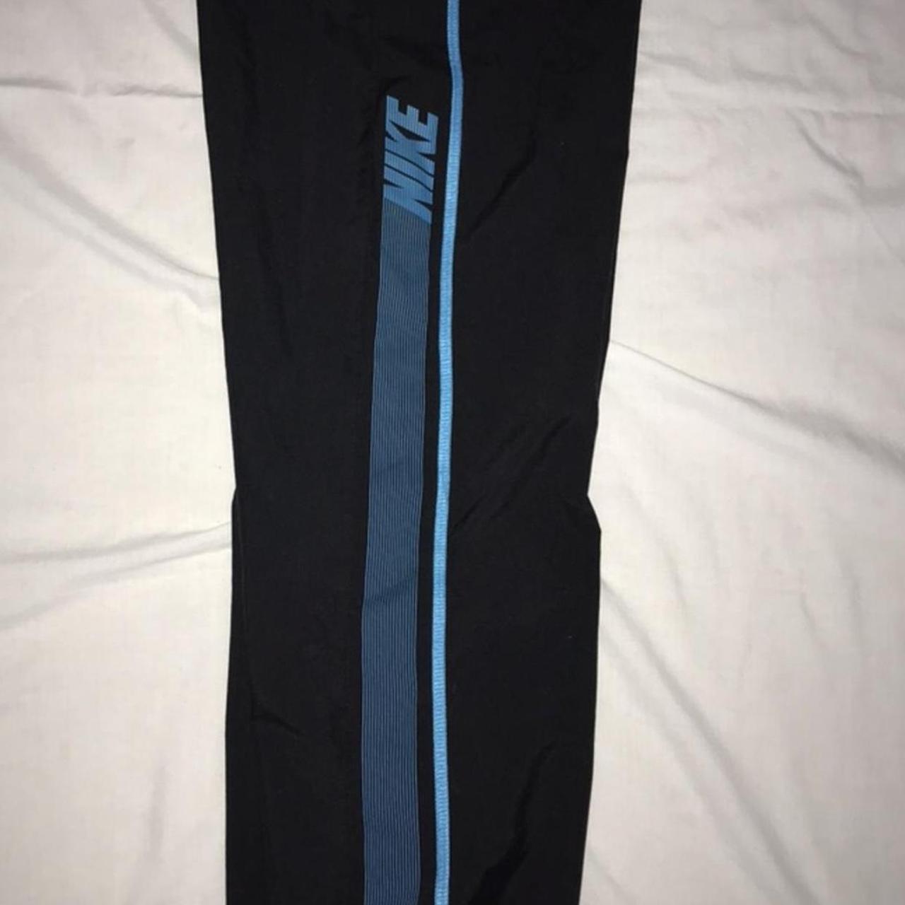 Nike trackies with blue lining and writing Fit xs... - Depop