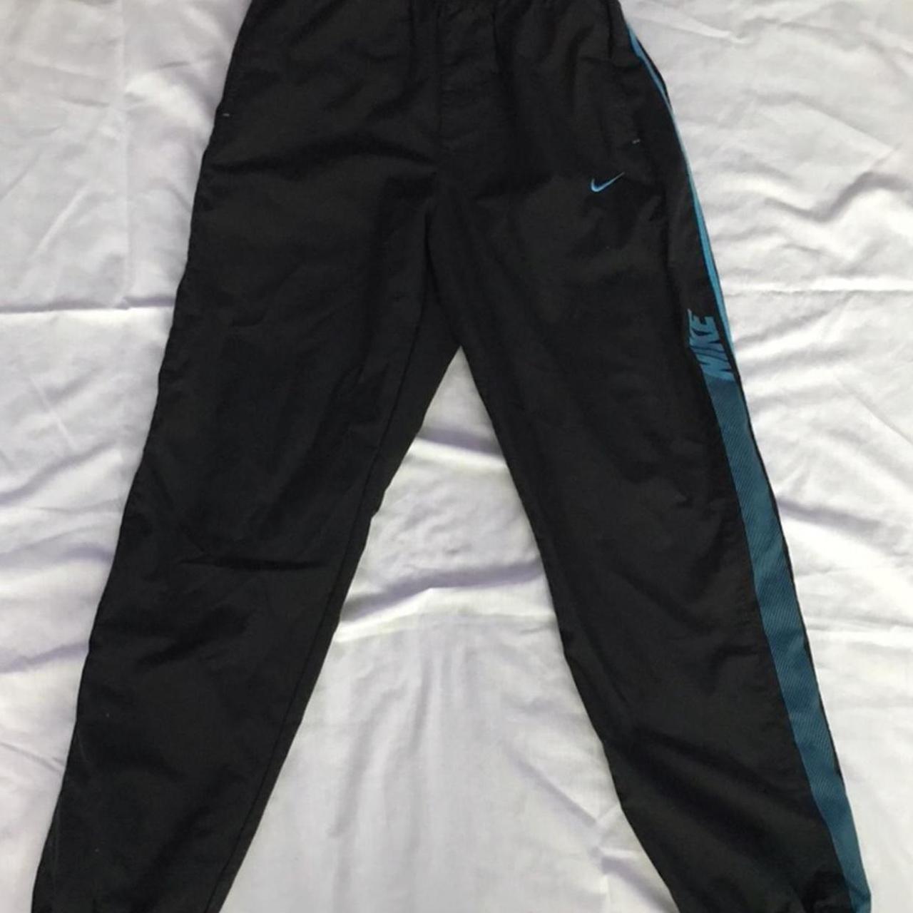 Nike trackies with blue lining and writing Fit xs... - Depop