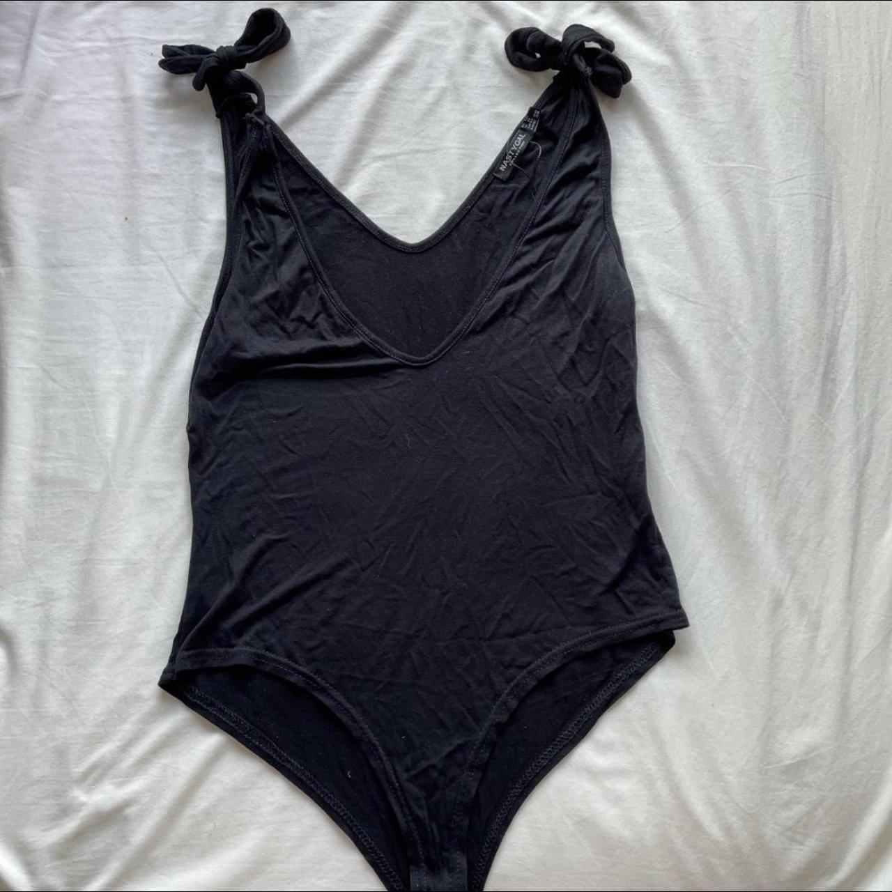 Black body suit with tie straps, straps are... - Depop