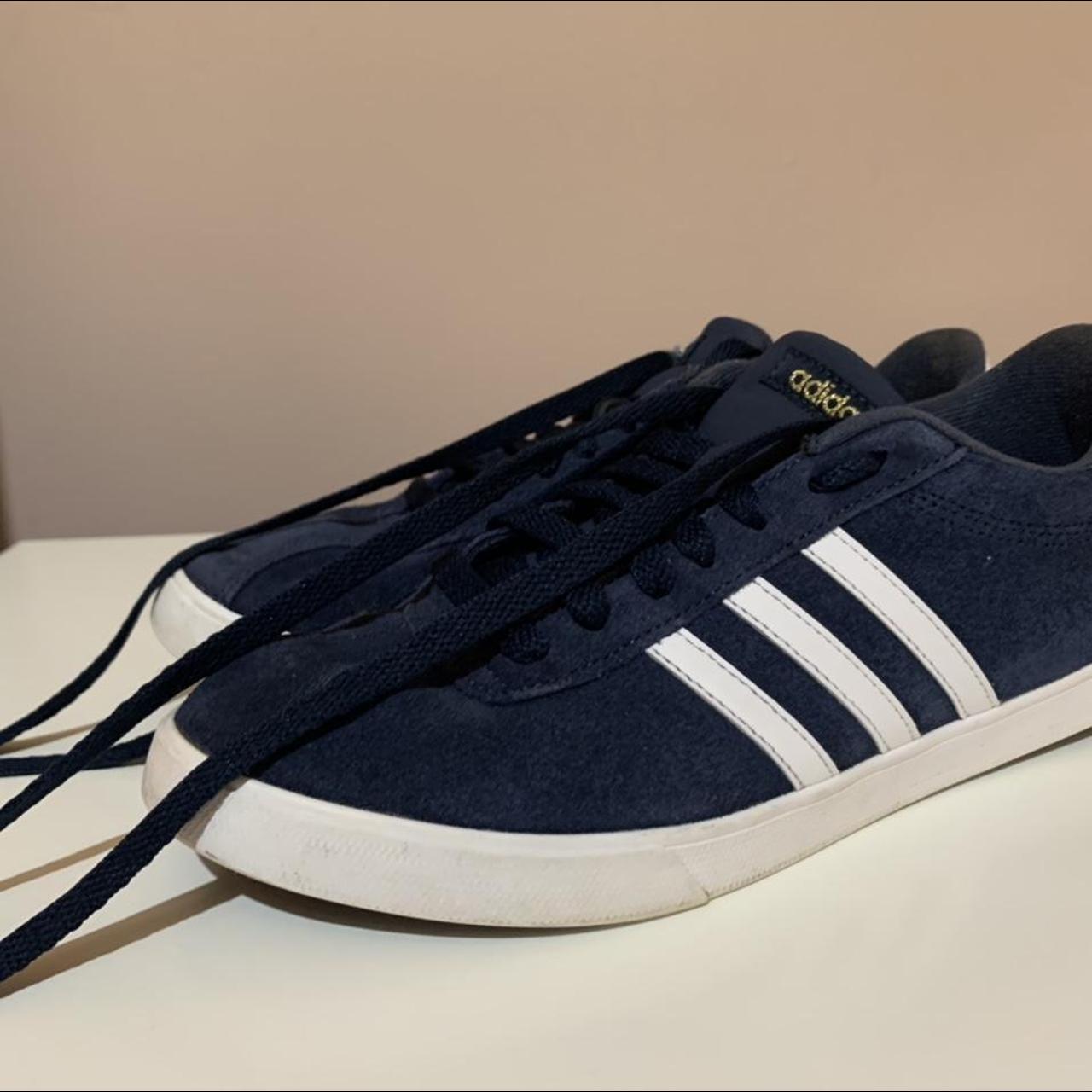 Navy adidas trainers. Wear and tear shown. Can be... - Depop