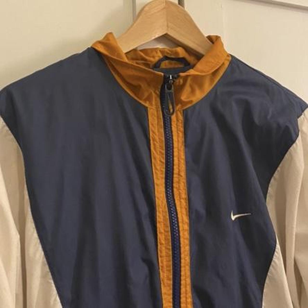 orange and white nike windbreaker