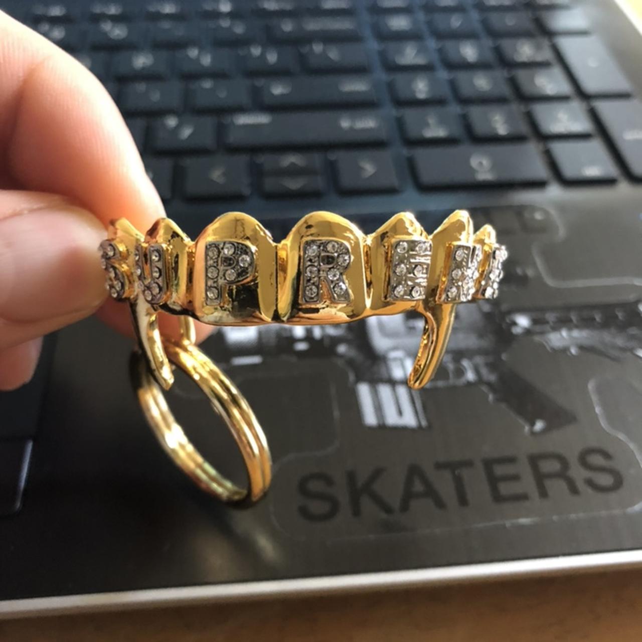 supreme fronts keychain gold