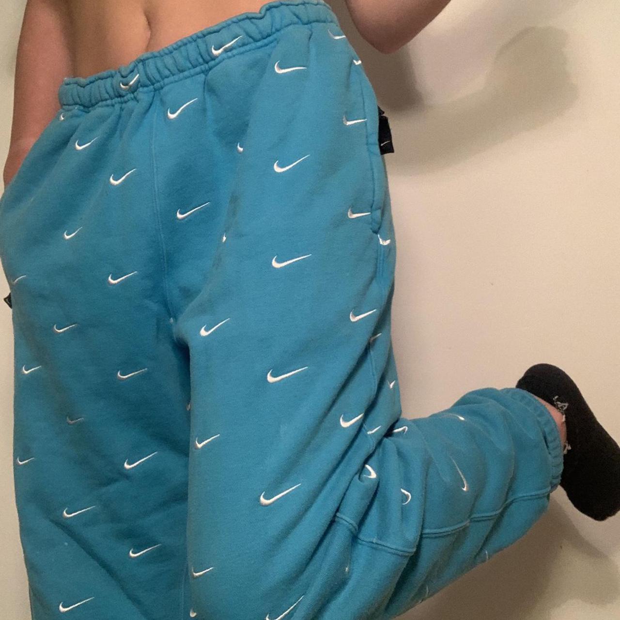 nike all over swoosh logo pants