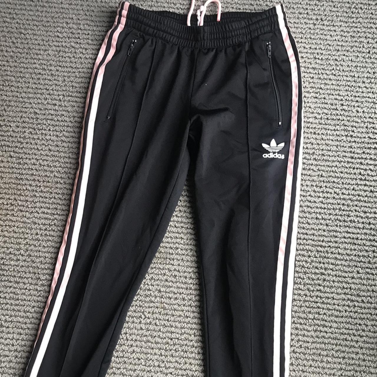 Adidas black track pants with pink stripe. Size XS. - Depop