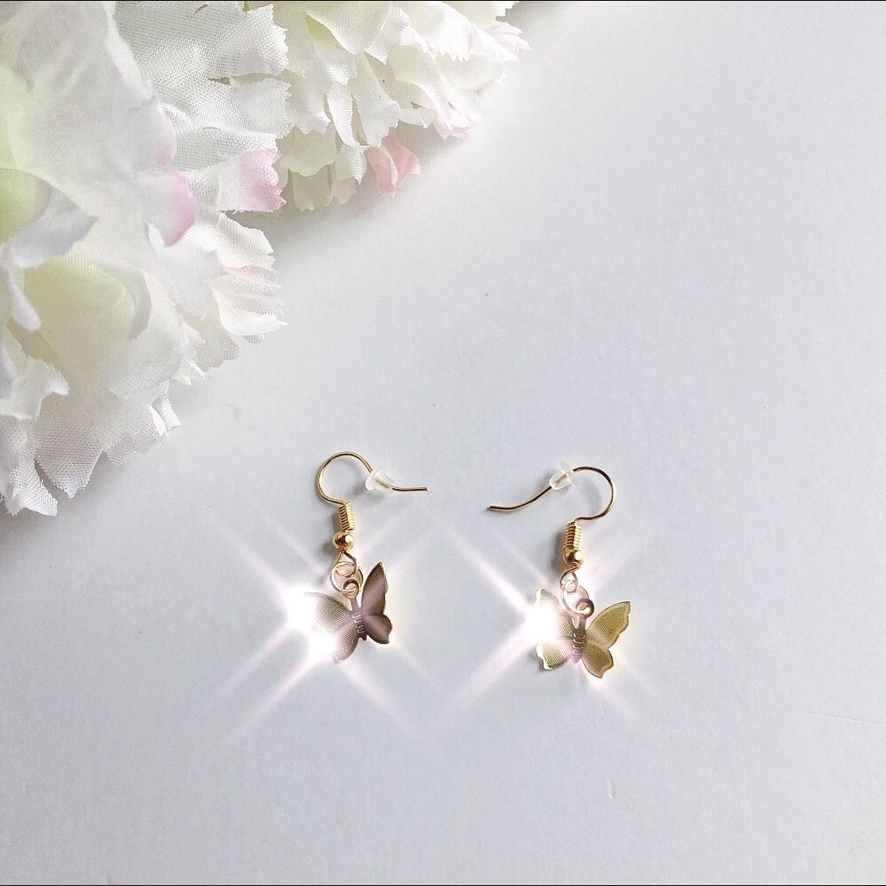 golden fluttering butterfly earrings details:... - Depop