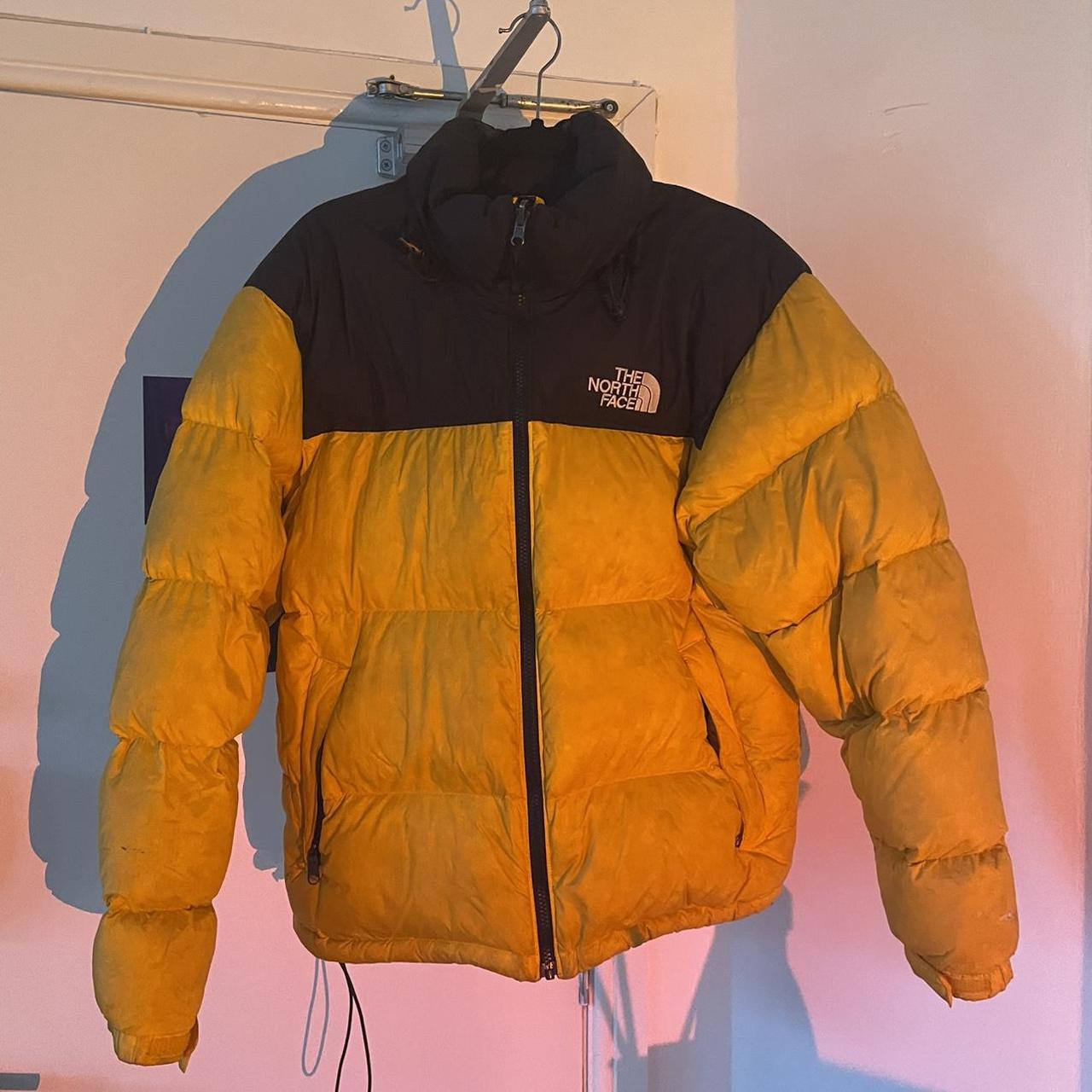 orange north face puffer jacket