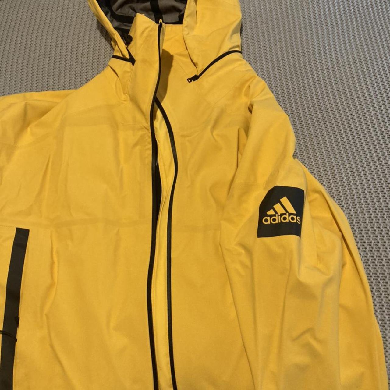 Adidas yellow rain jacket online