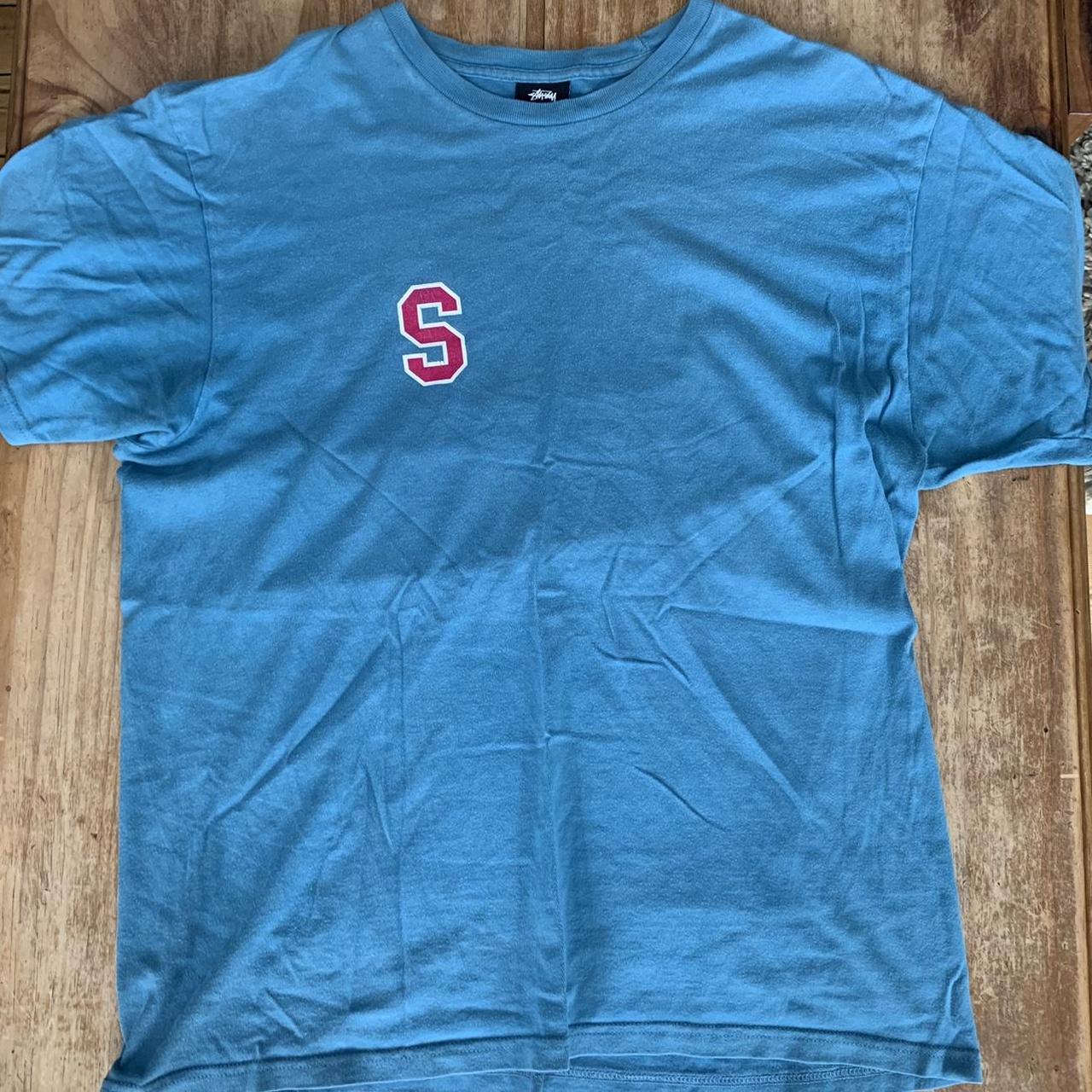 Light blue Stüssy t shirt with varsity graphic. Size... - Depop