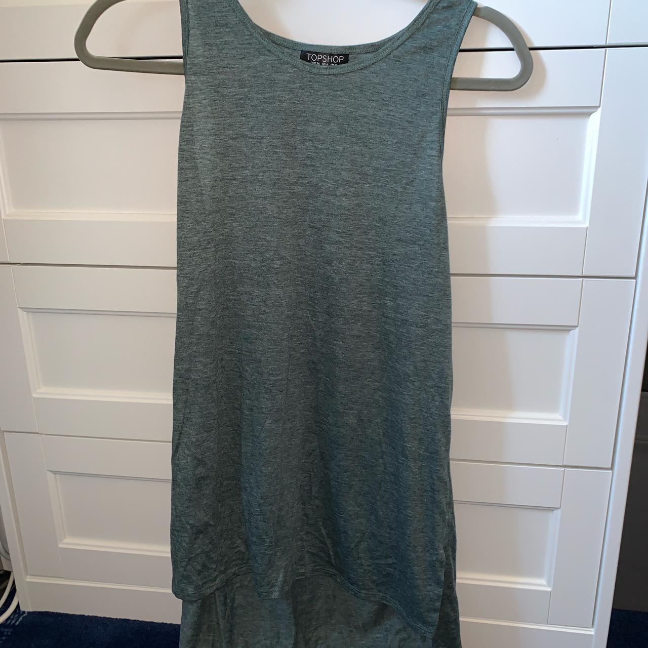 Green vest top Size 8 Long style at the back Depop