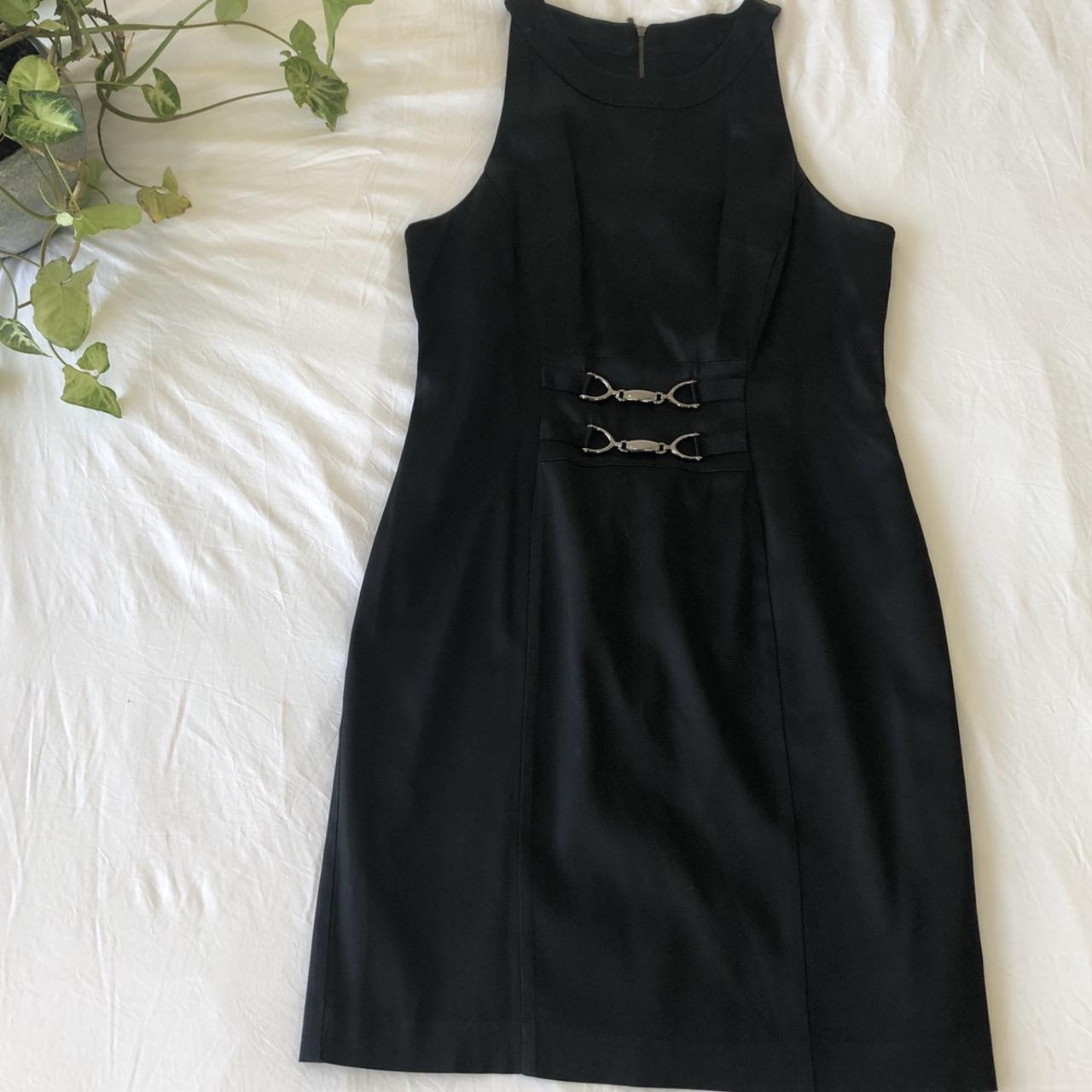 Cue black evening dress with metal embellishments on... - Depop