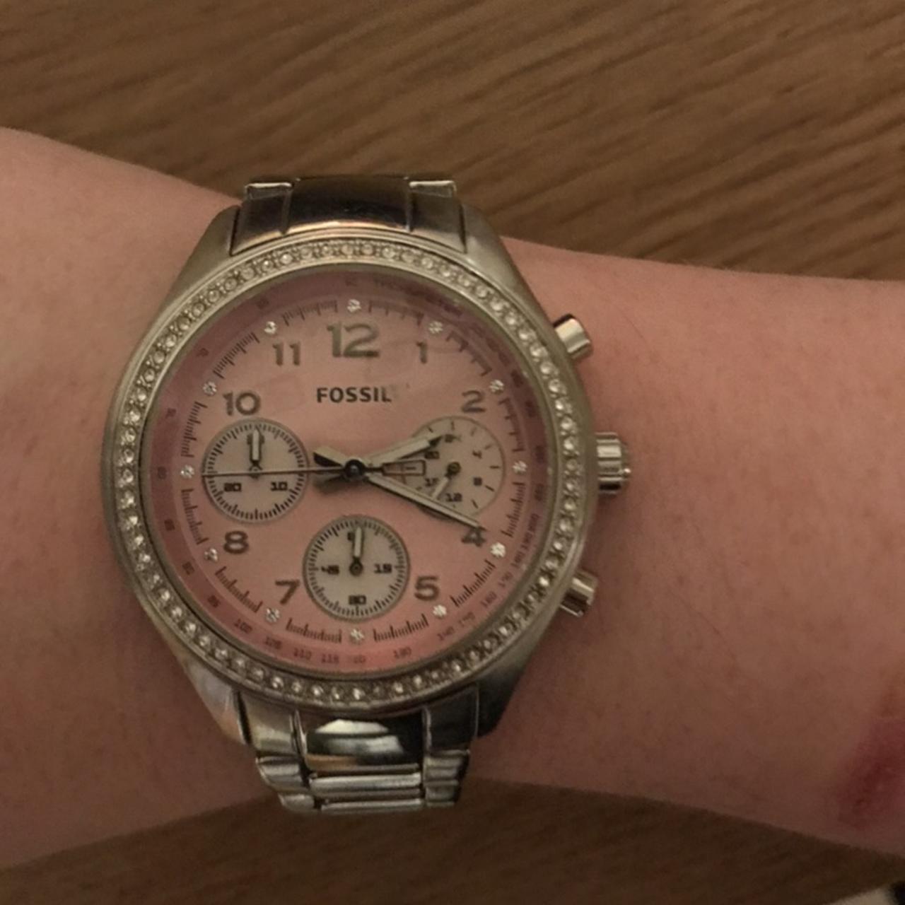 Silver fossil watch with pink outlet face