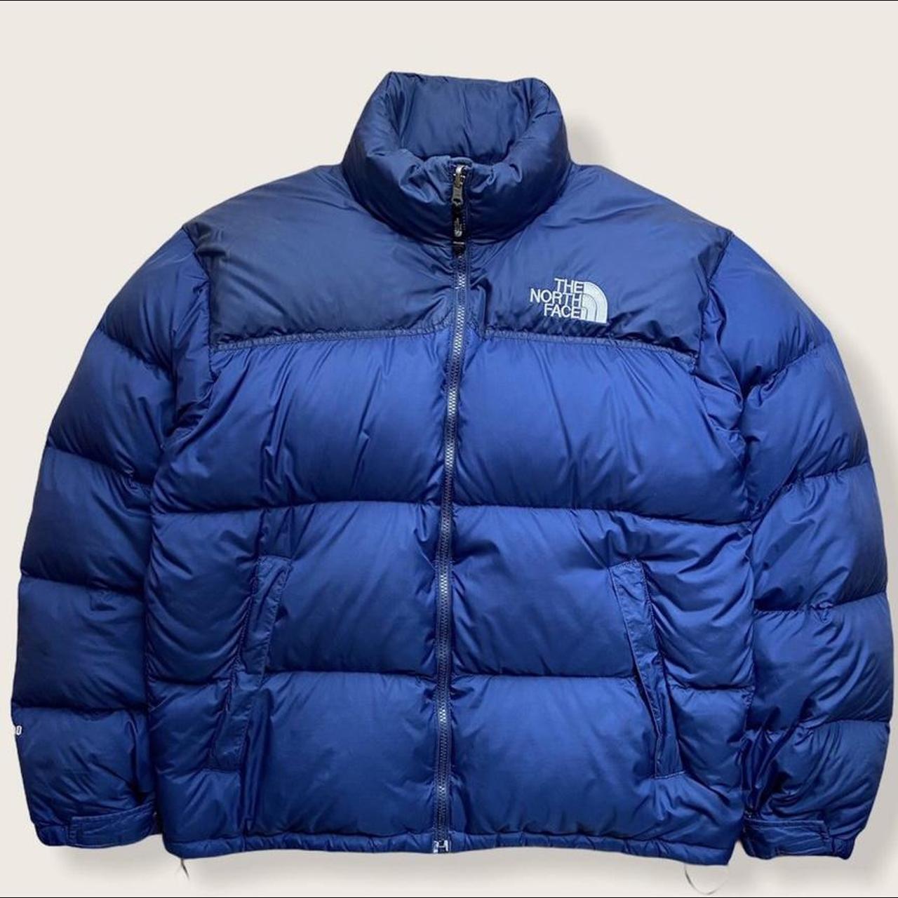 dark blue and black north face puffer