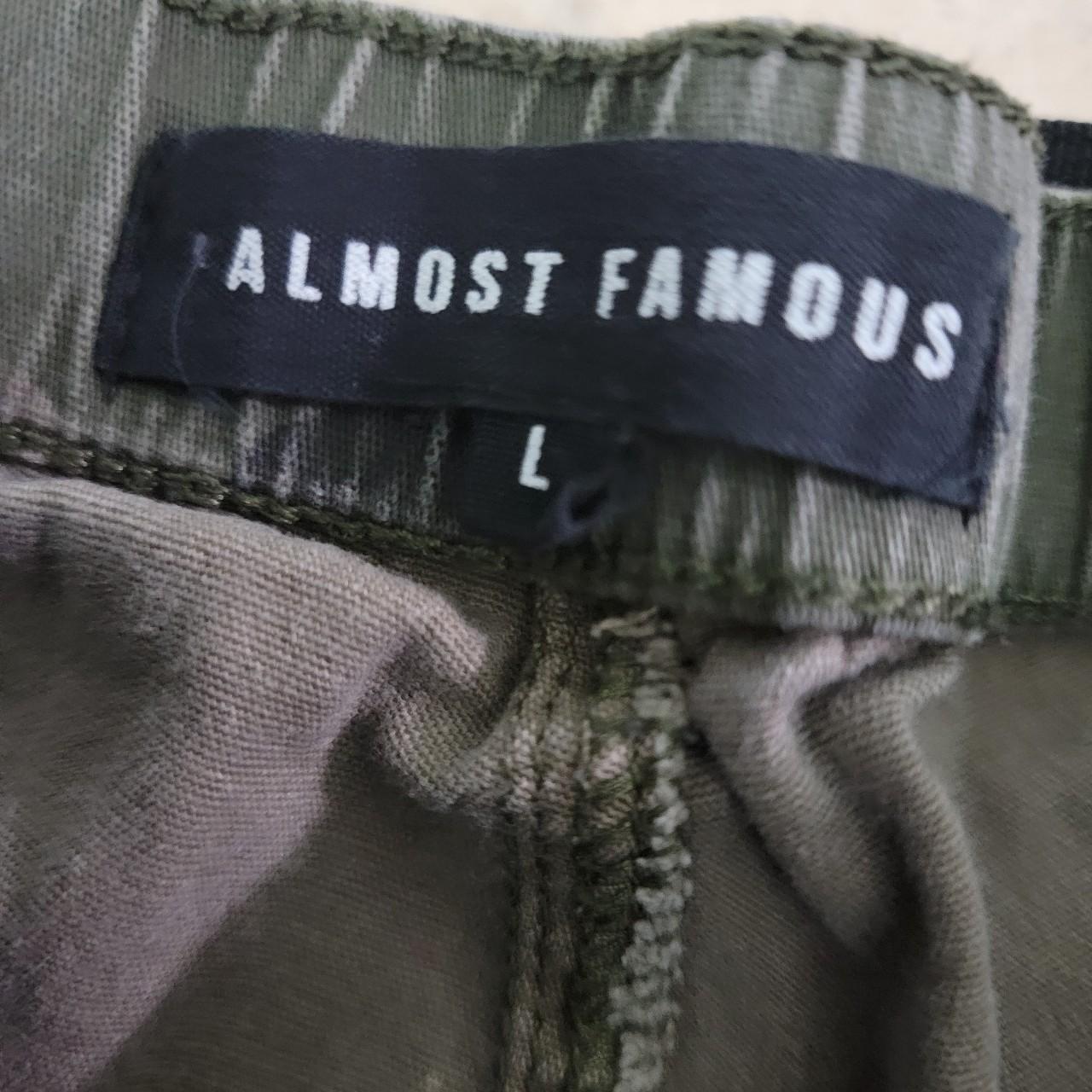 High Waisted camo cargo pants with four pockets and... Depop