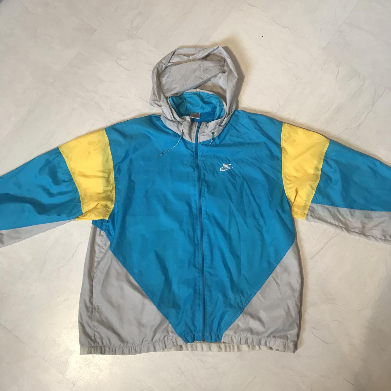 blue and yellow nike windbreaker