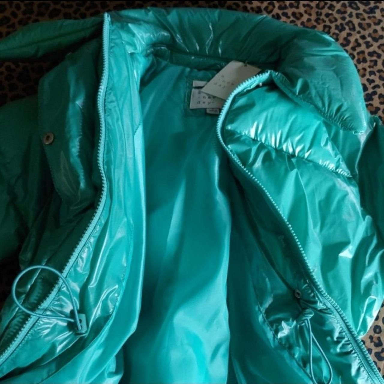 A new day puffer teal green in color beautiful with... - Depop