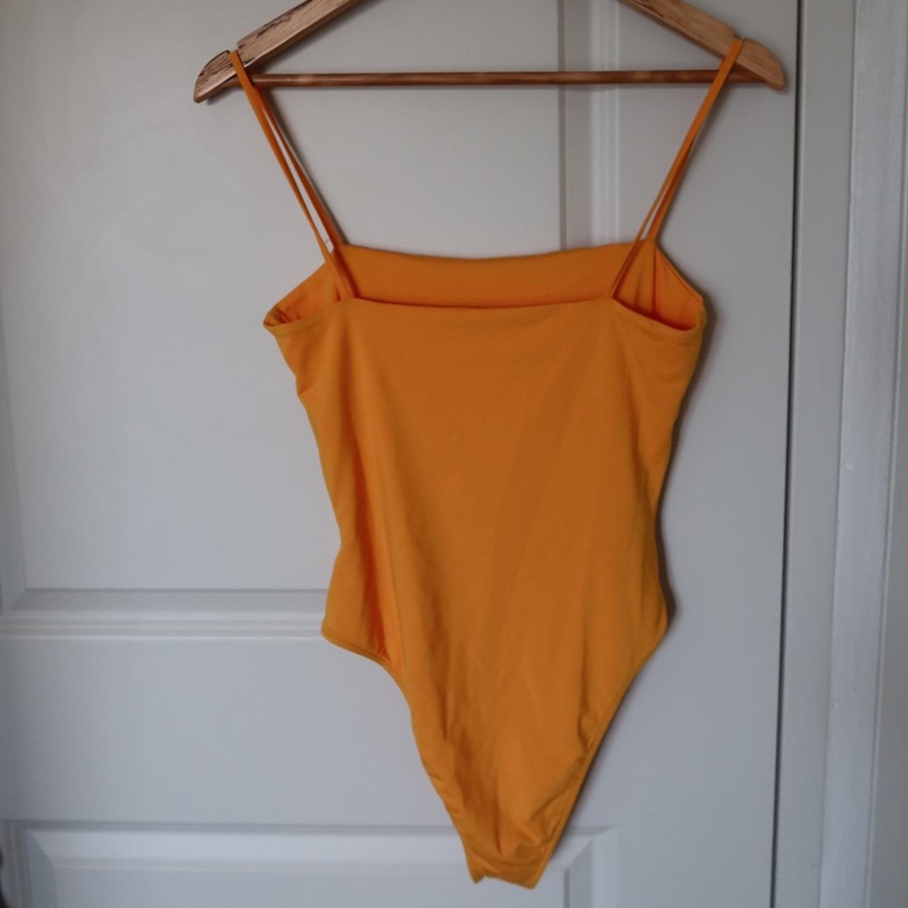 Kookai yellow bodysuit in size 2 (fits xsm) Barely... Depop