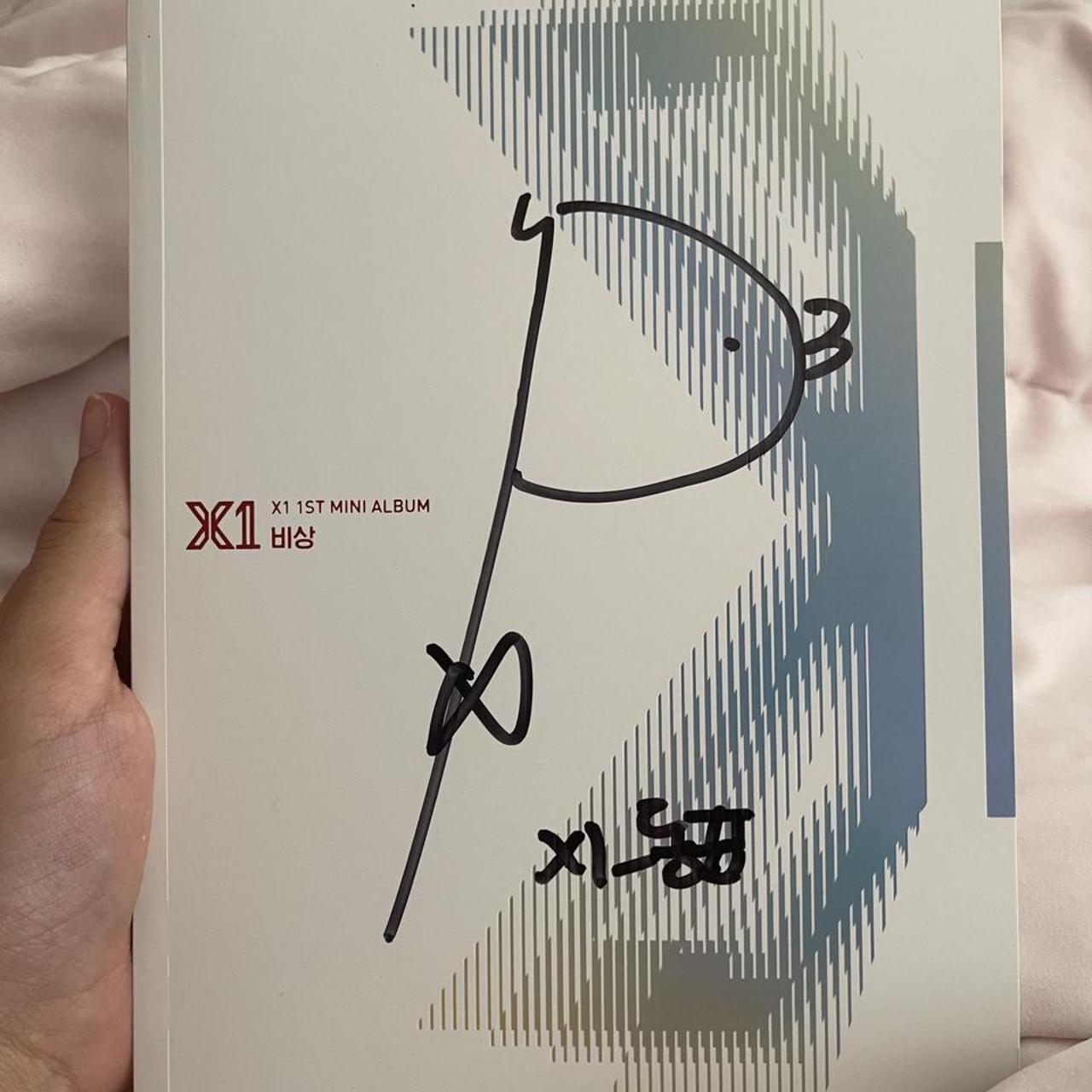 X1 signed album store