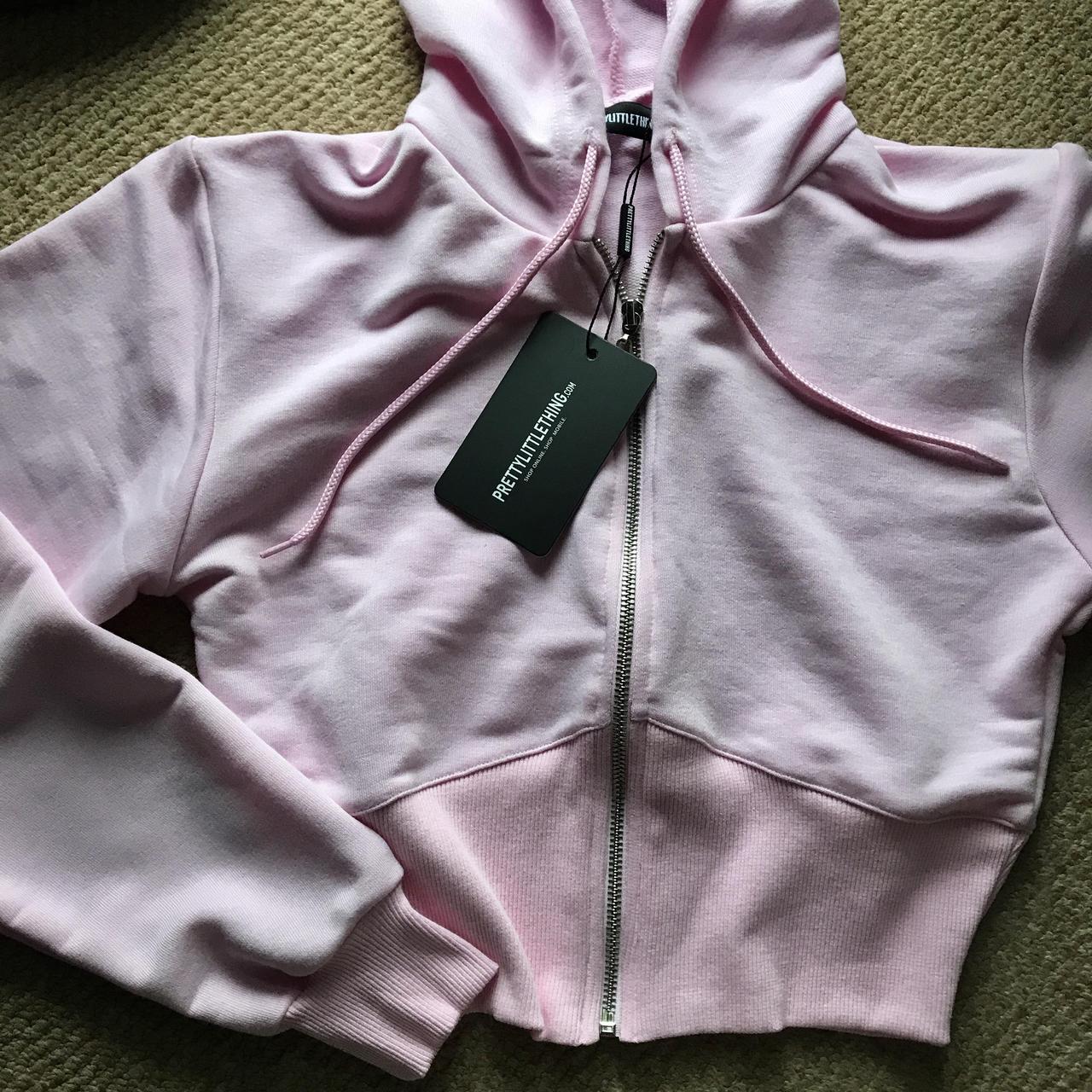 Unworn baby pink zip up bustier hoodie by Pretty... - Depop