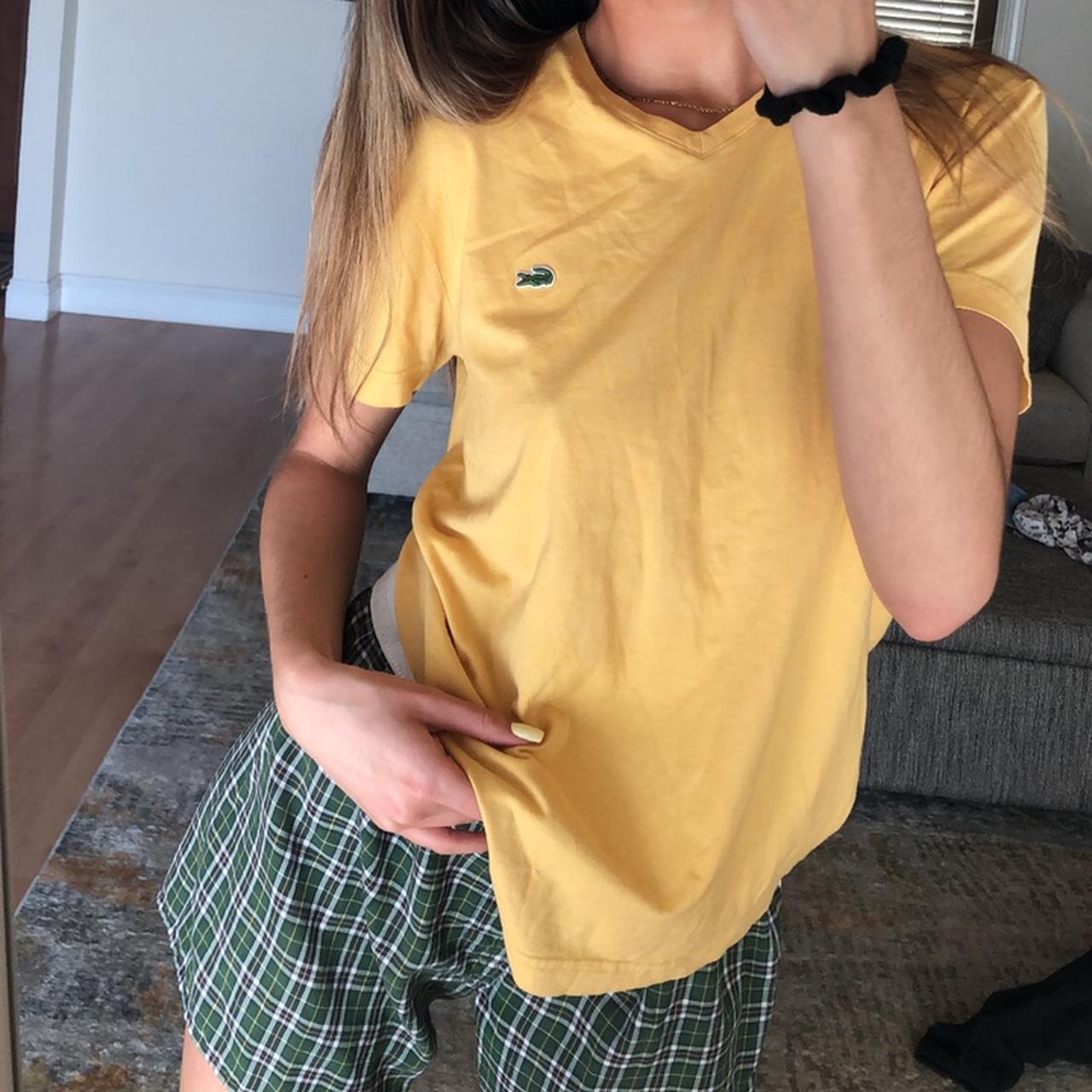 Adorable light pale yellow Lacoste vneck tshirt. Depop