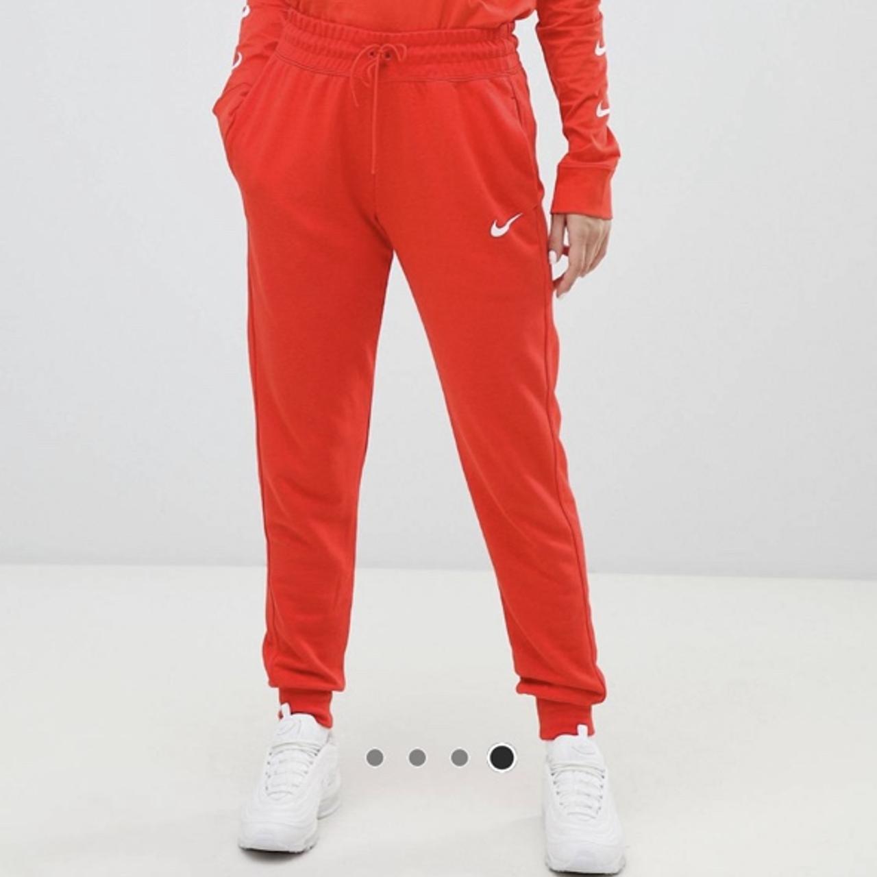 red nike trackies