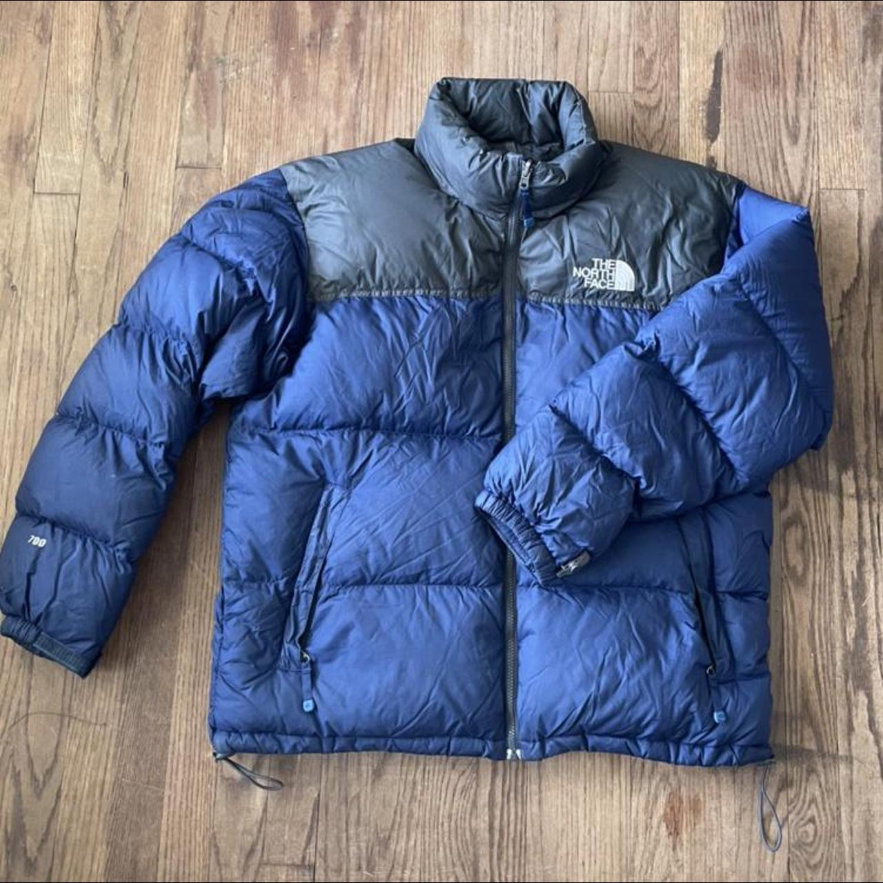 dark blue and black north face puffer