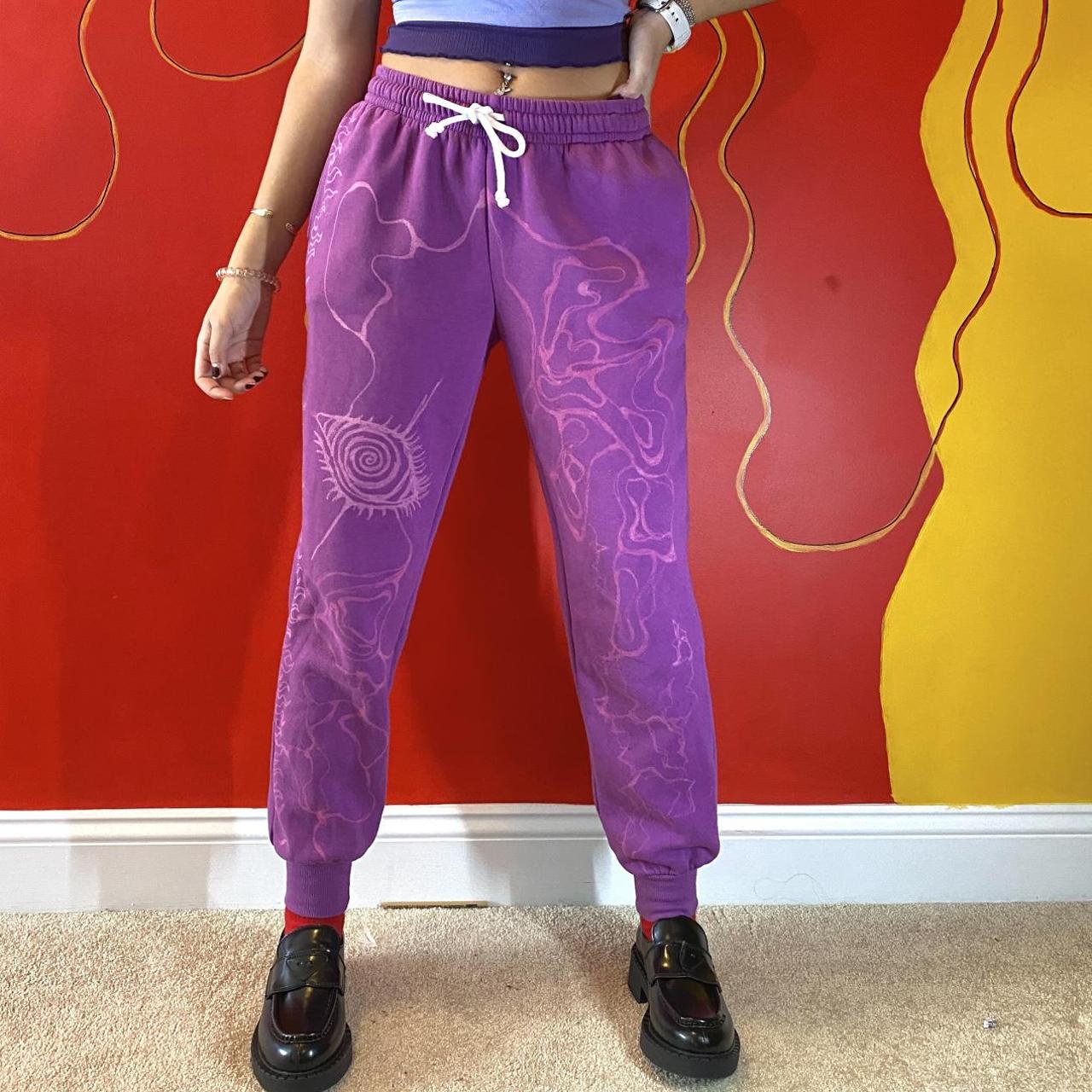 Reworked magenta sweatpants with bleach