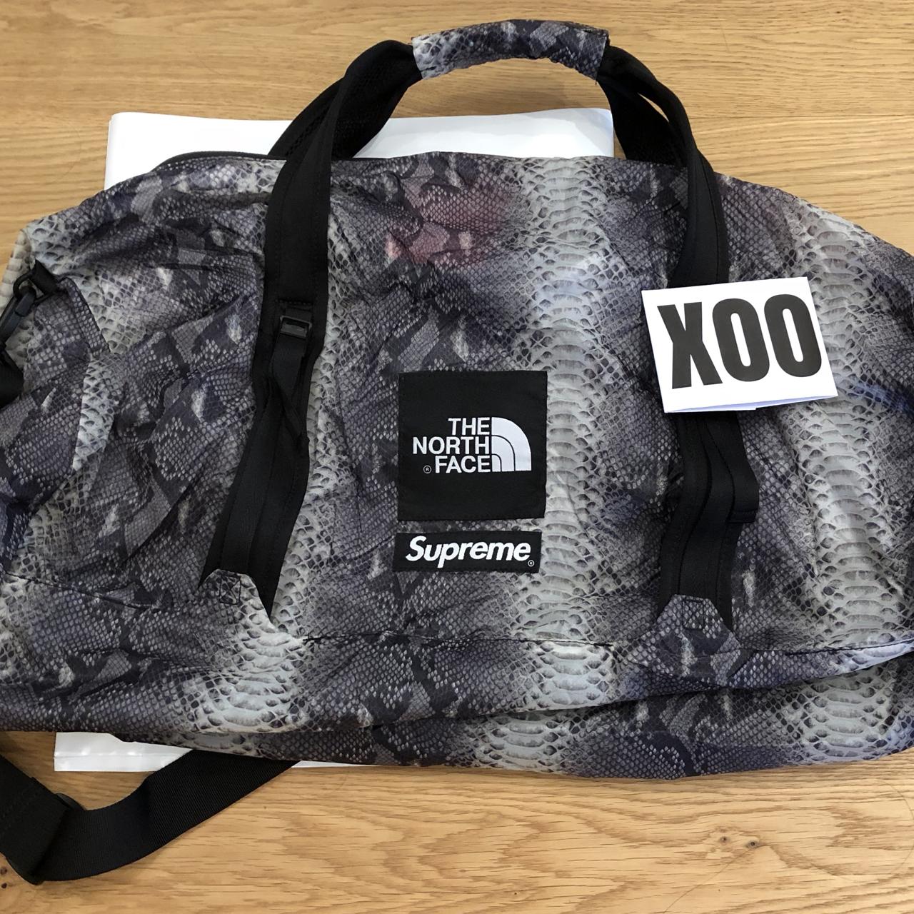 Supreme x North Face snakeskin flyweight duffle...