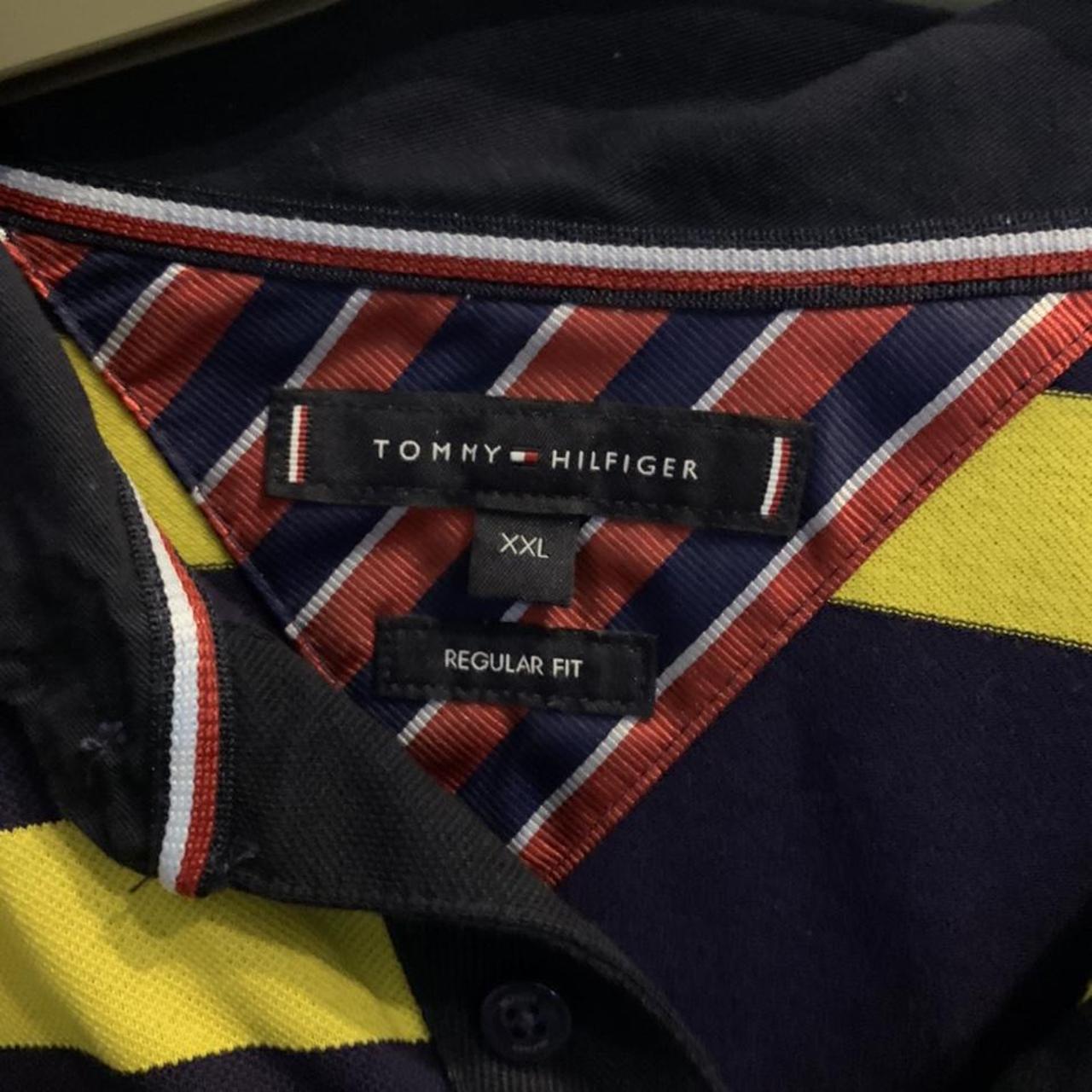 Tommy Hilfiger navy and yellow polo shirt. Size XXL.... - Depop