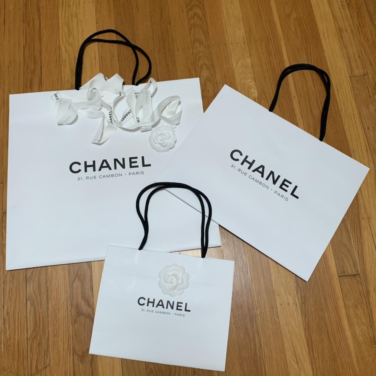 authentic chanel white paper bag with one of the - Depop