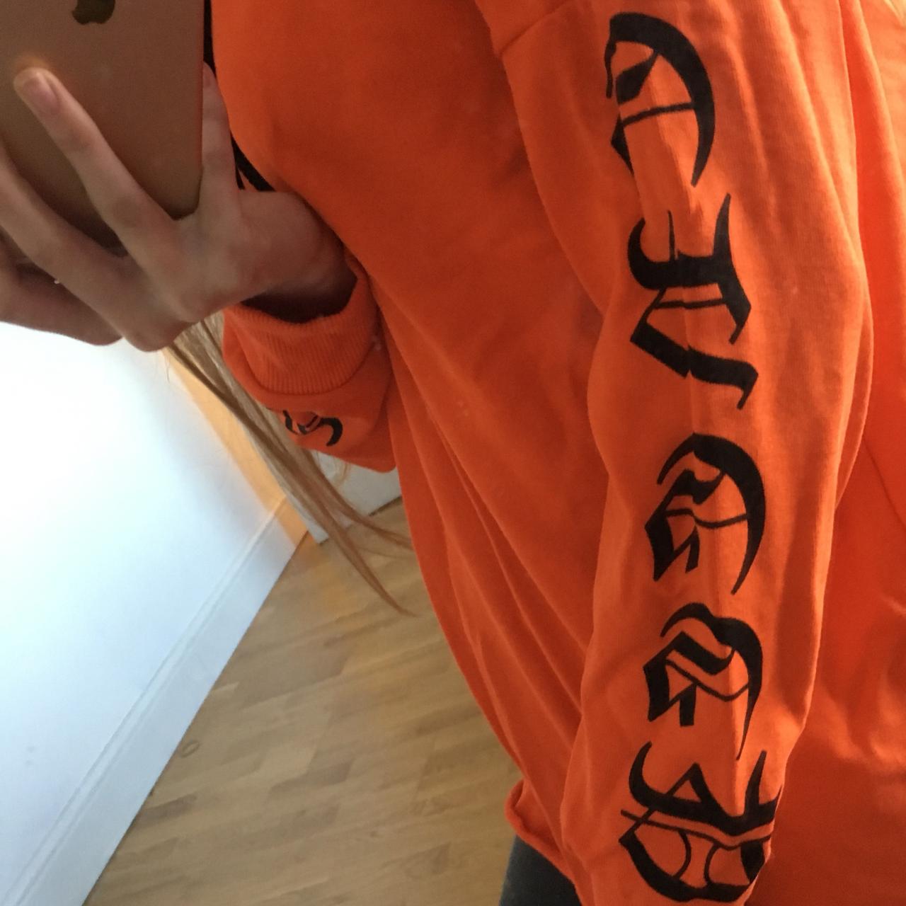 Orange hoodie sale with black writing