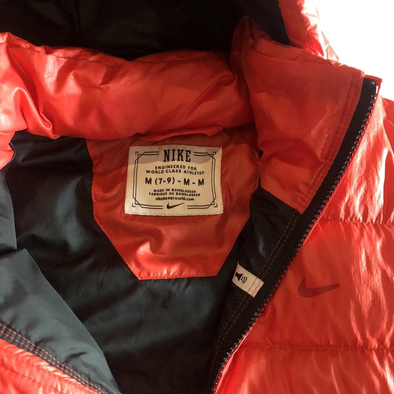 Orange/red vintage Nike puffa jacket with hood.... - Depop